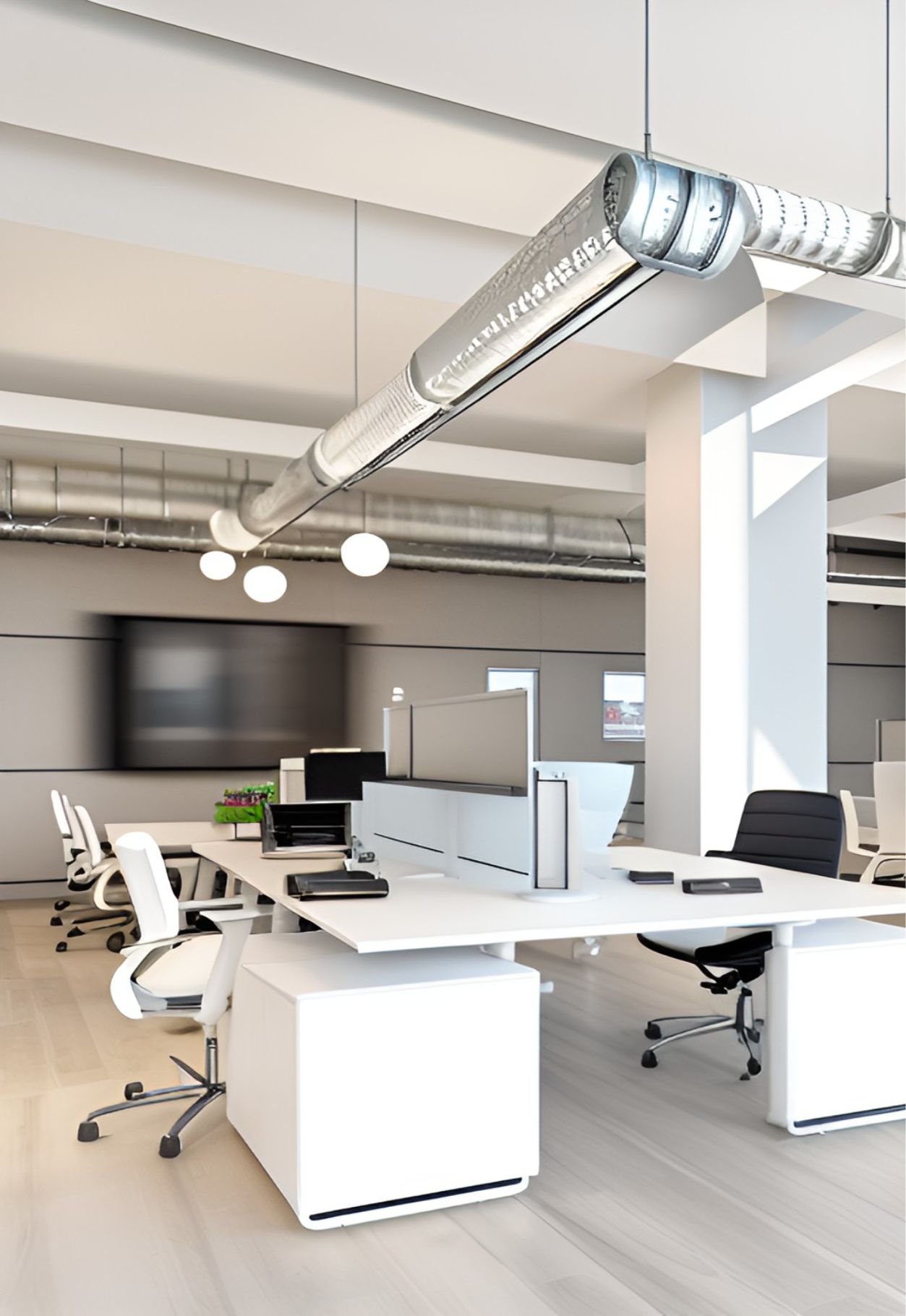 contoh gambar desain ruangan kantor industrial ( design interior office industrial ) office industrial style with a white pillar, table with seperator and X legs shape, some white chair with black part on the back rest, 2 boxes with a drawer each,  3 white hanging lamps, pipes decorating the ceiling